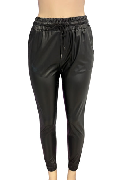 Black shiny pants on a white background