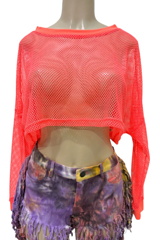 Mannequin wearing a bright orange mesh top and colorful shorts on a white background
