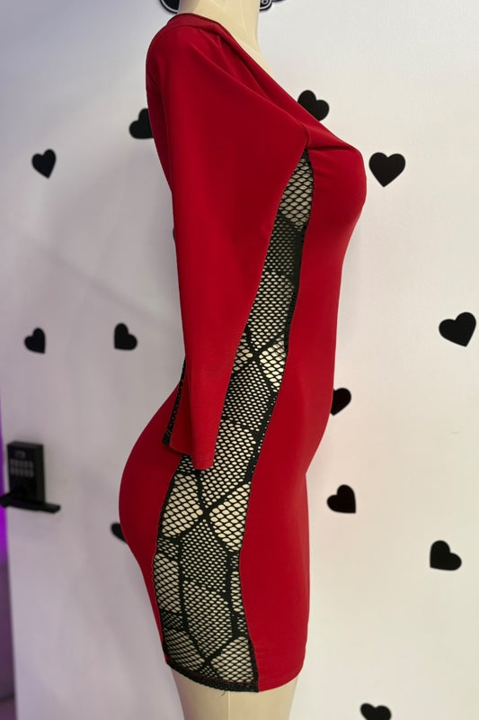 Red dress with black fishnet panels on a mannequin against a white background with black heart shapes.
