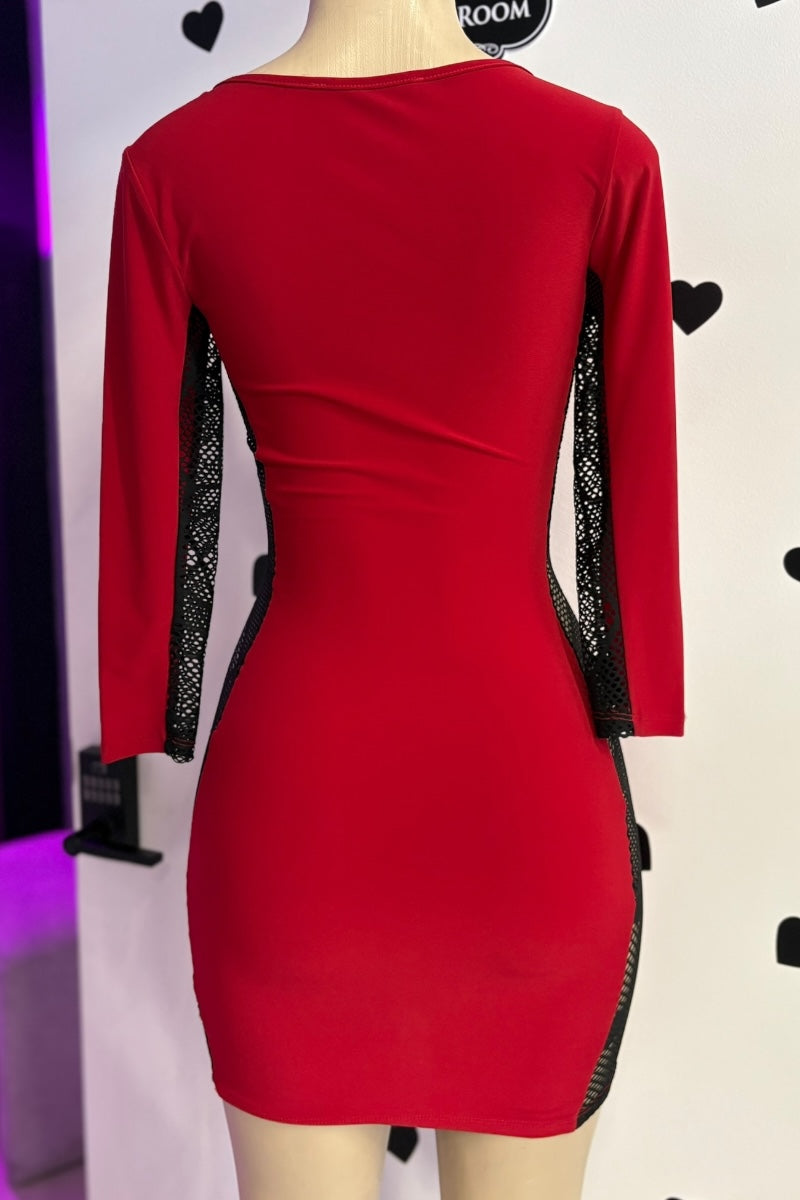 Red dress with black mesh panels on a mannequin against a white background