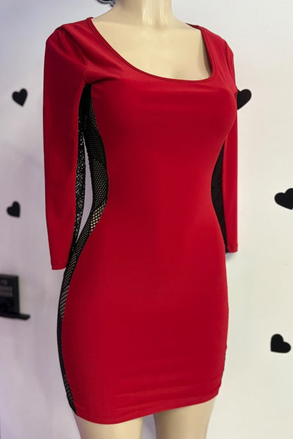 Red dress with black mesh panels on a mannequin against a white background