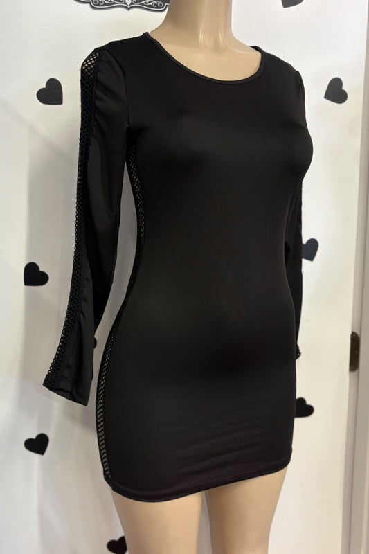 Black dress with mesh sleeves on a mannequin against a white background with black heart shapes.