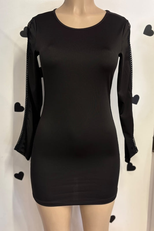 Black dress with unique sleeve designs on a mannequin against a white background