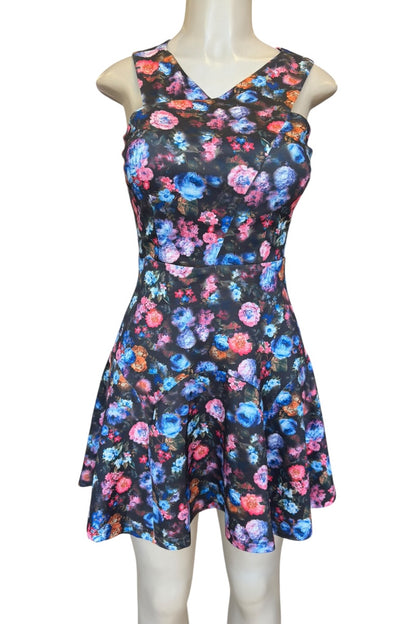 Floral dress on a mannequin against a white background