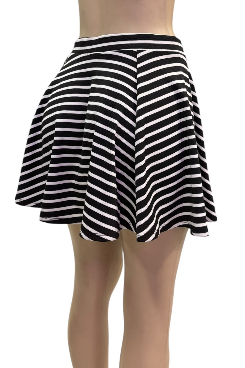 Black and white striped skirt on a plain background