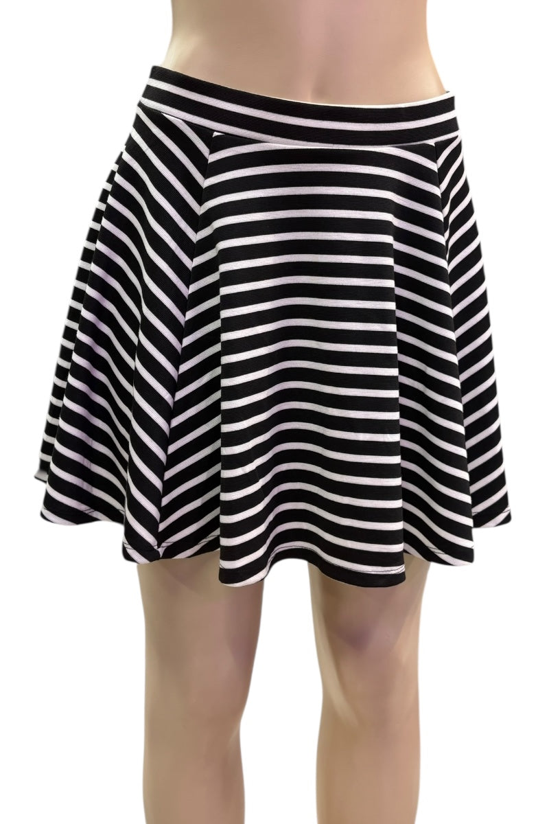 Black and white striped skirt on a plain background