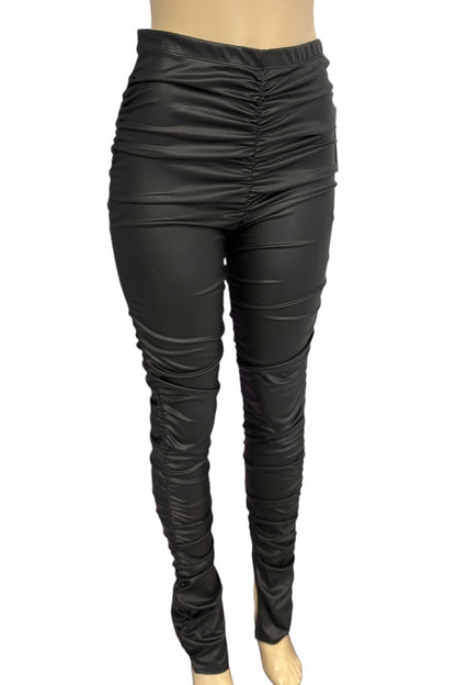 Black leather leggings on a white background