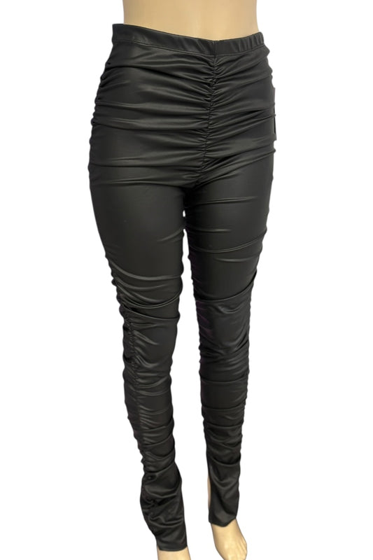 Black leather leggings on a white background