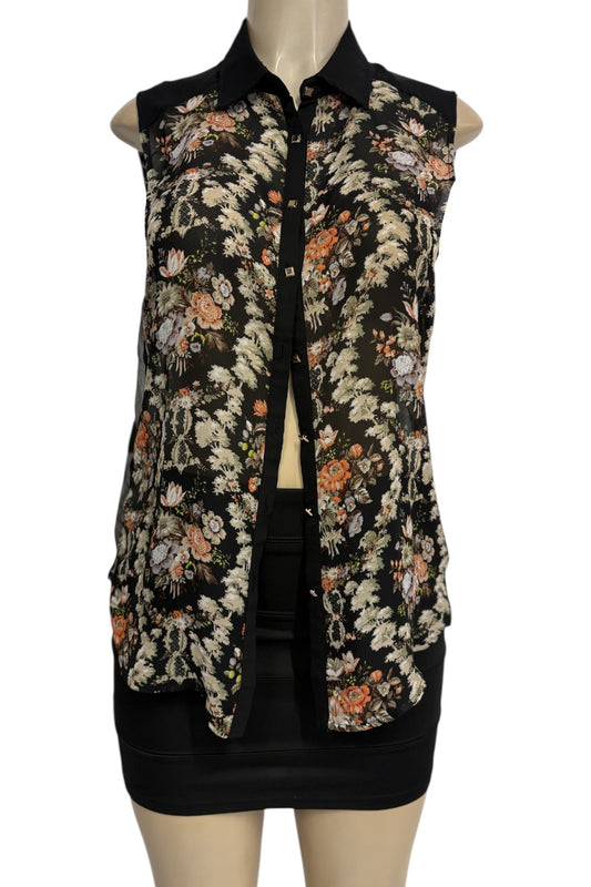 Floral patterned top on a mannequin against a white background