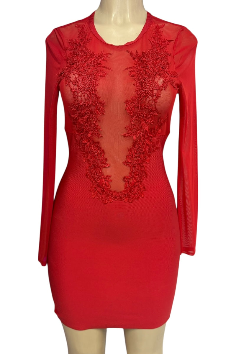 Red dress with lace detailing on a mannequin against a white background