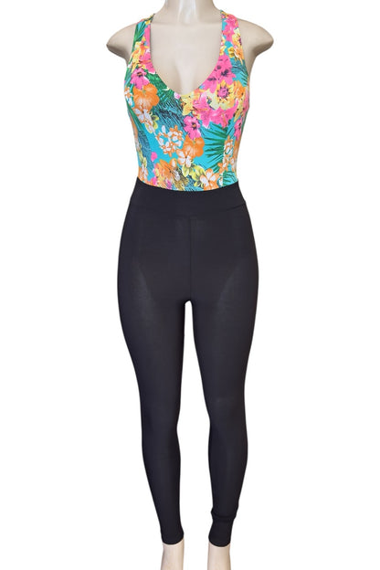 Mannequin wearing a colorful floral top jumpsuit on a white background