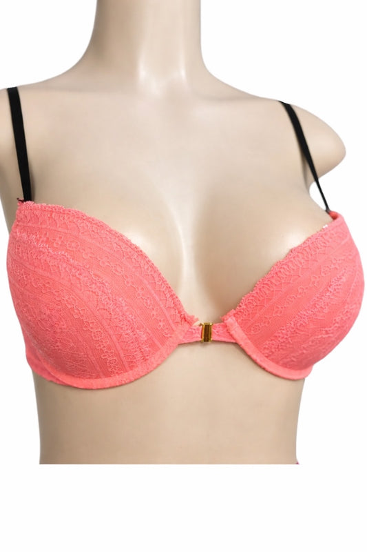 Coral bra on a mannequin with a white background