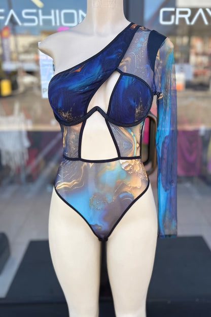 Mannequin wearing a colorful bodysuit with a blurred store background