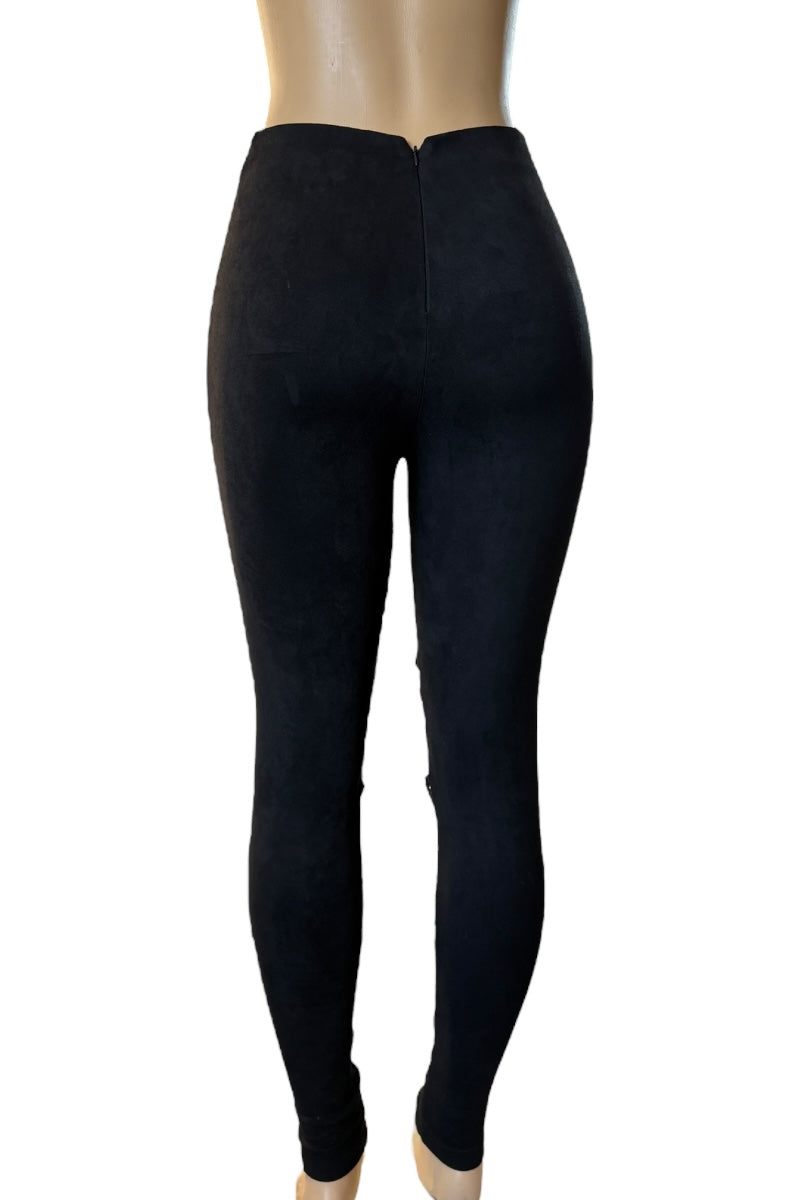 Black leggings on a mannequin against a white background