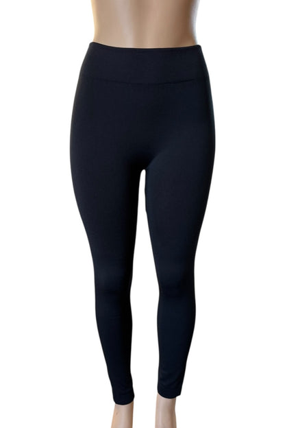 Black leggings on a mannequin against a white background