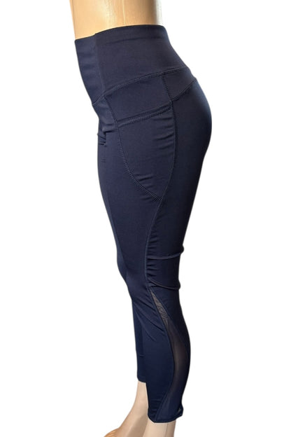 Navy blue leggings on a mannequin against a white background