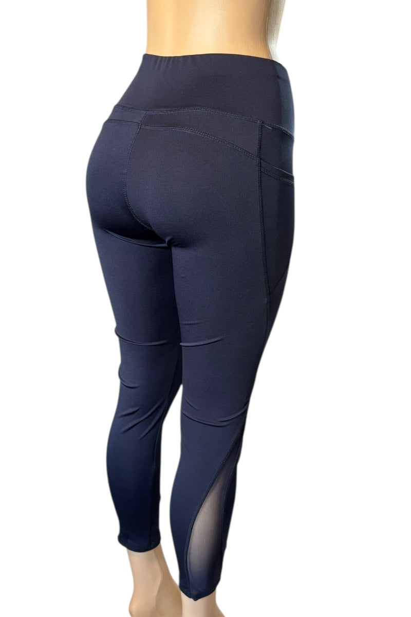 Navy blue leggings with mesh panels on a white background