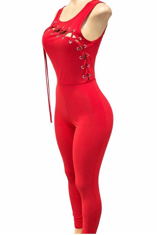 Red jumpsuit with lace-up details on a white background