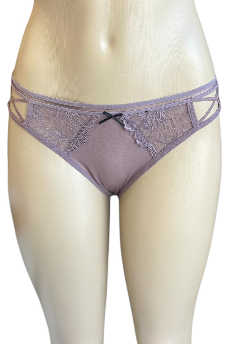 Purple lace underwear on a mannequin against a white background