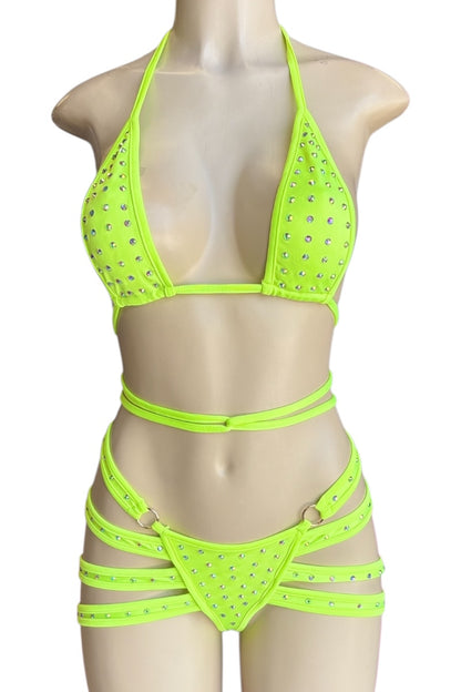 Neon yellow bikini set with rhinestone details on a mannequin against a white background