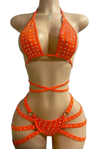 Orange bikini set with rhinestone details on a mannequin against a white background
