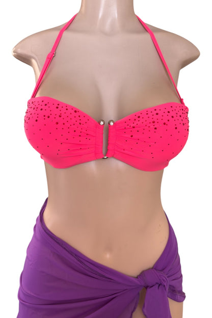 Coral bikini top on a mannequin with a purple sarong