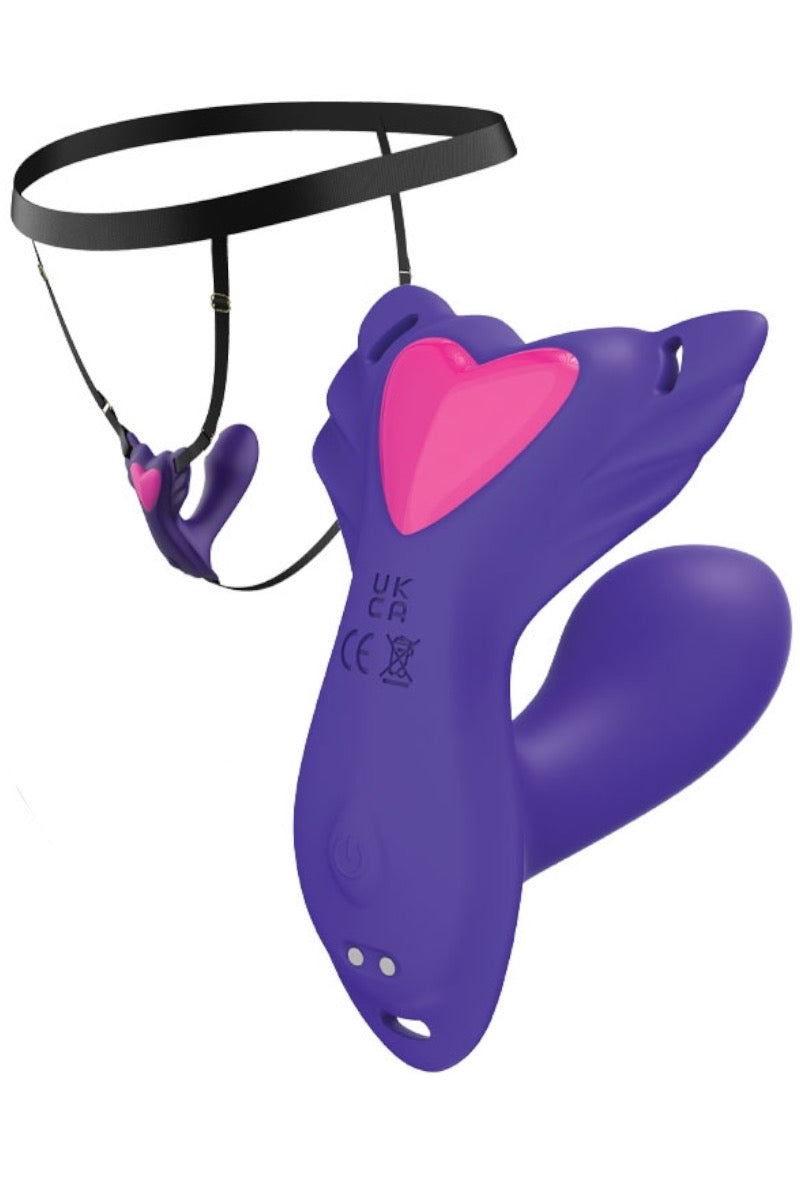 Purple and pink silicone adult novelty device with a black waist strap, shown on a plain white background.