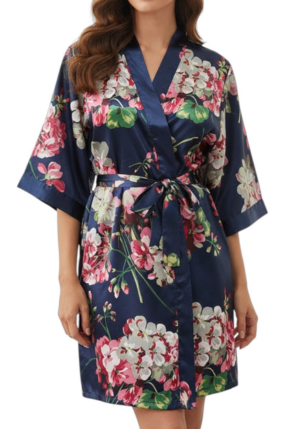 Floral robe with a navy background worn by a model