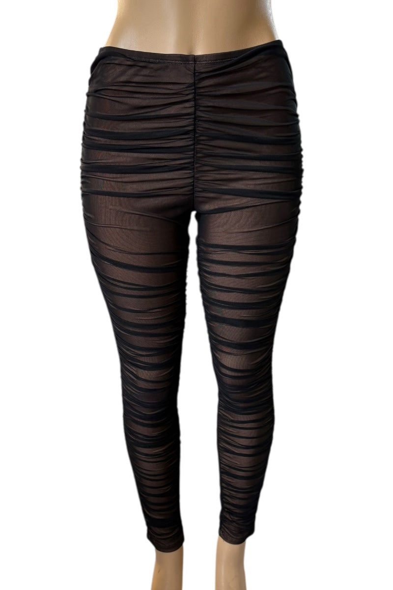 Black mesh leggings on a mannequin against a white background