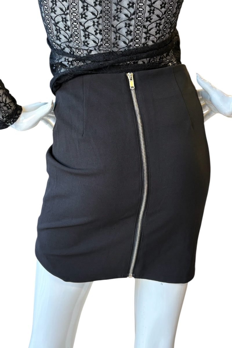 Black skirt with a zipper on a mannequin against a white background