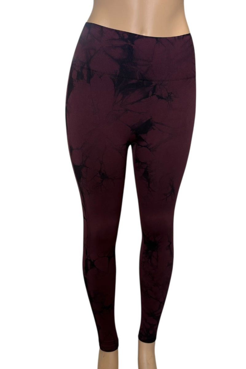 wine leggings with a subtle pattern on a white background