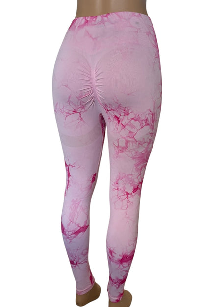 Pink tie-dye leggings on a white background