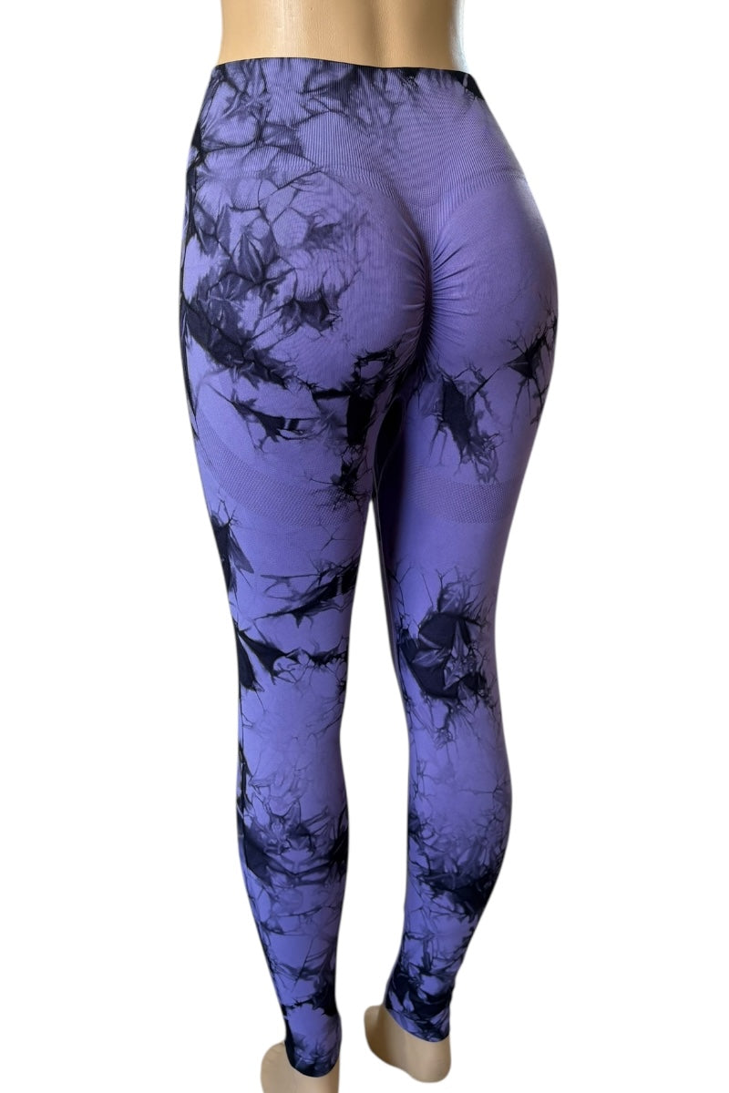 Purple leggings with black abstract pattern on a white background