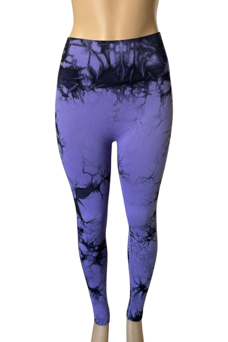 Purple leggings with black abstract pattern on a white background