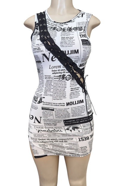 Dress with newspaper print on a mannequin against a white background