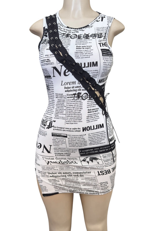 Dress with newspaper print on a mannequin against a white background