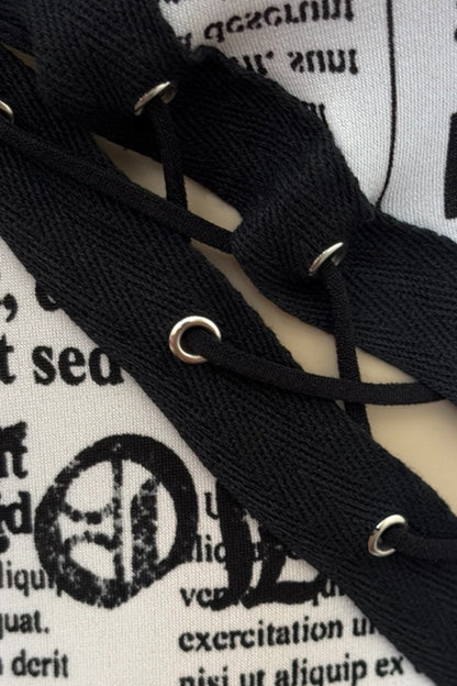 Close-up of black laces on a white surface with text