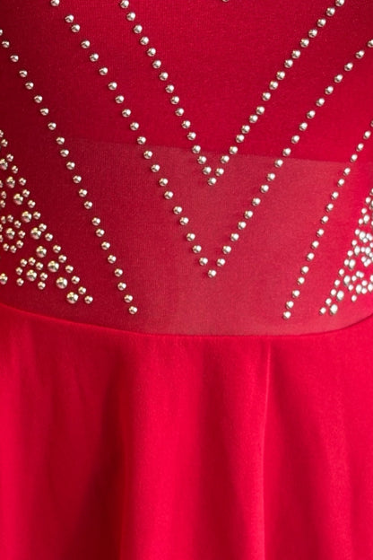 Red dress with bead embellishments on a plain background