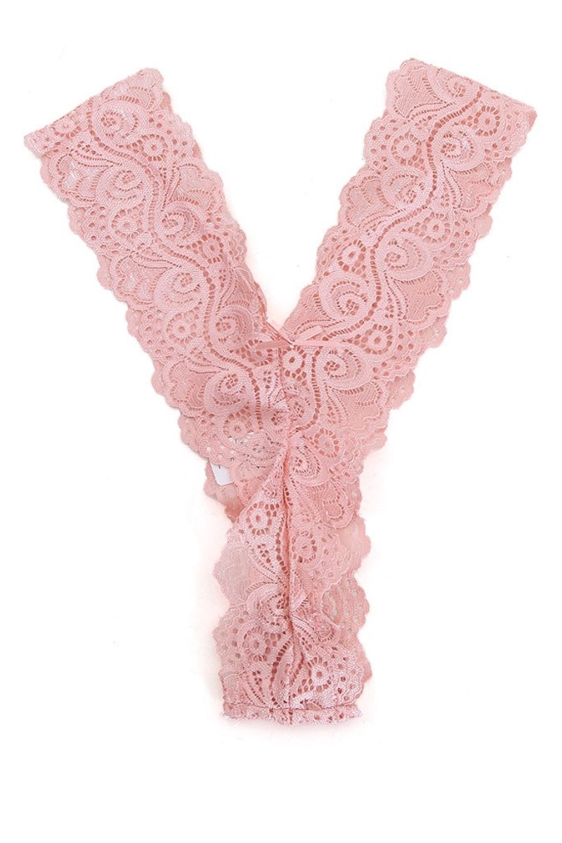 Pink lace thong on a white background