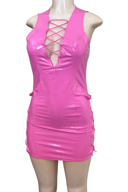 Pink dress with lace-up front on a mannequin against a white background