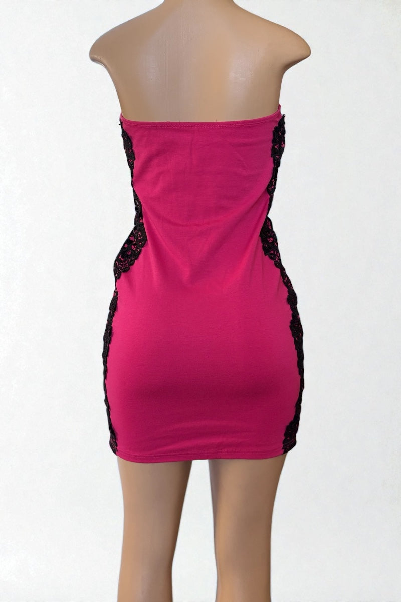 Pink strapless dress with black lace details on a white background