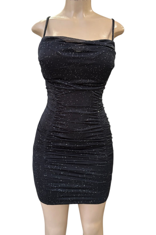 Black sparkly dress on a mannequin against a white background