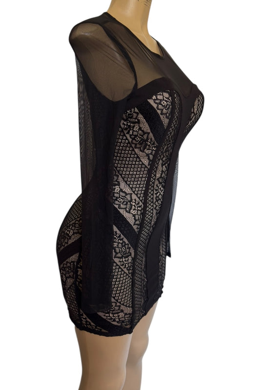 Black lace dress on a mannequin against a white background