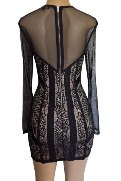 Black lace dress on a mannequin with sheer back design