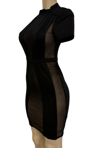 Black dress with sheer panels on a mannequin against a white background