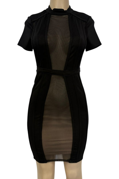 Black dress with sheer panels on a mannequin against a white background