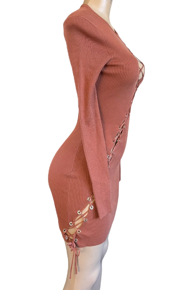 Terracotta ribbed dress with lace-up sides on a mannequin against a white background