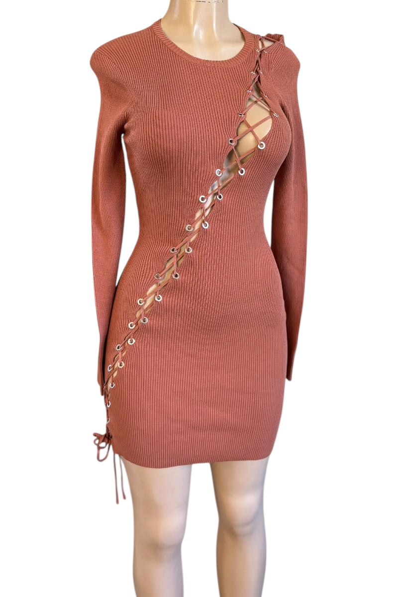 Terracotta ribbed dress with lace-up side on a mannequin against a white background