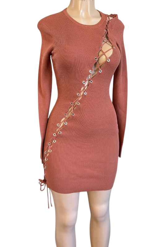 Terracotta ribbed dress with lace-up side on a mannequin against a white background