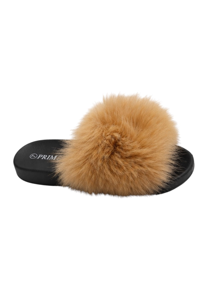 Camel color fur slide sandal with black sole on a white background